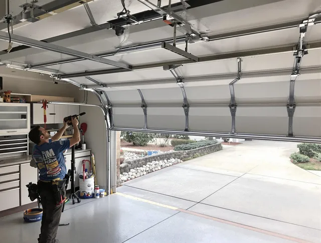 Garage door track repair service by Warren Garage Door Repair in Warren